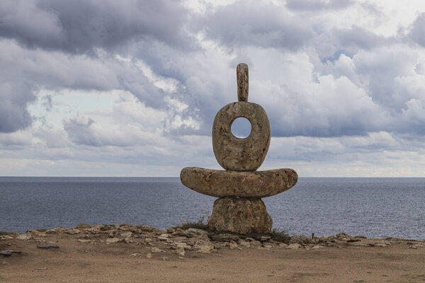 Crimea. Cape Tarkhankut. Sculpture "The Thinker" on the White Rock