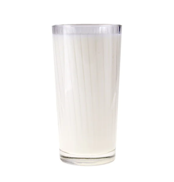 Vaso de leche sobre un fondo blanco — Foto de Stock