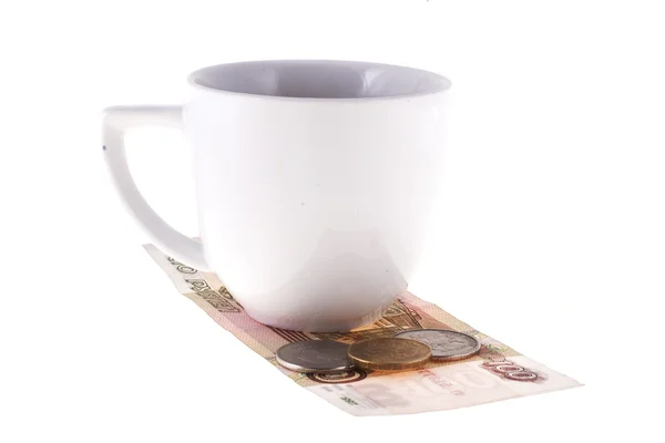 Gorjeta, dinheiro deitado sob a xícara de café — Fotografia de Stock