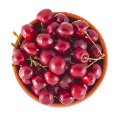 Plate with ripe cherry on a white background