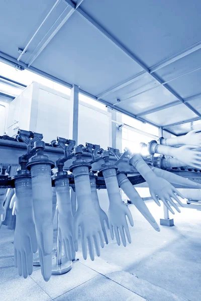 Acrylonitrile butadiene gloves production line in a factory, nor — Stock Photo, Image