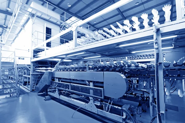 Acrylonitrile butadiene gloves production line in a factory, nor — Stock Photo, Image