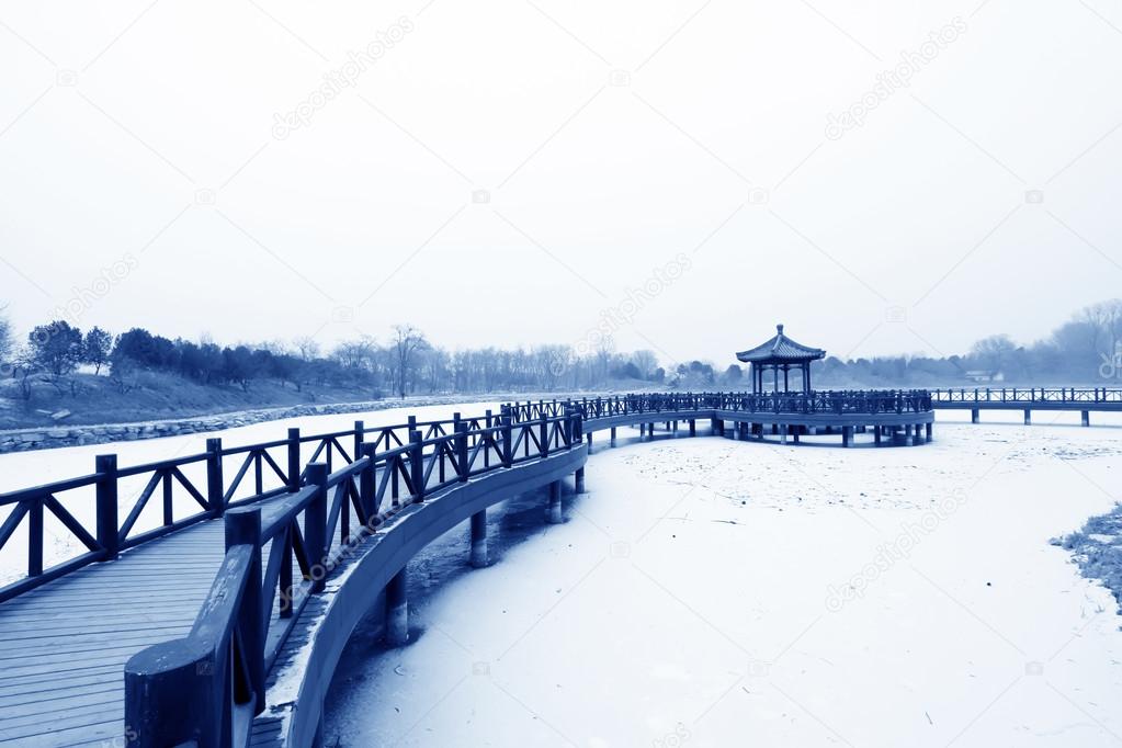wooden bridge in the snow