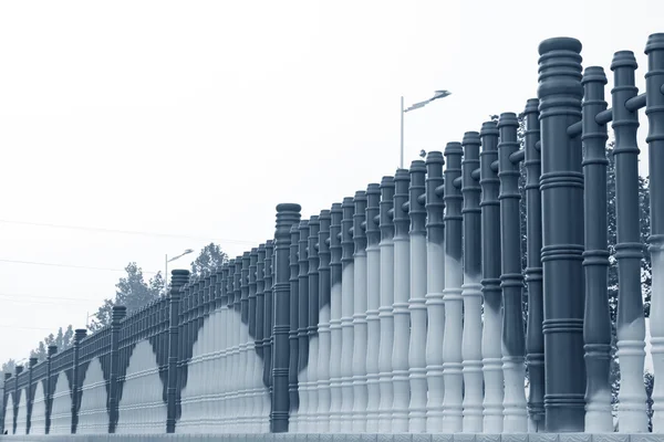 Cylindrical fence wall — Stock Photo, Image