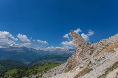 Bizarre shaped rocky peak near a hiking trail, Dolomites, Italy