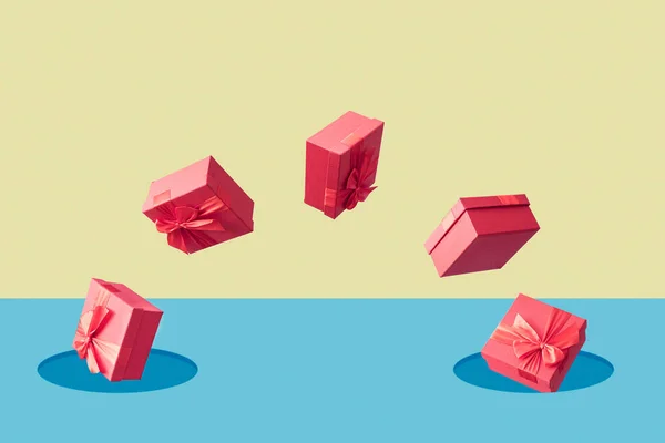 Red Gift Boxes Fly Out Fall Hole Pastel Background Minimal — 스톡 사진