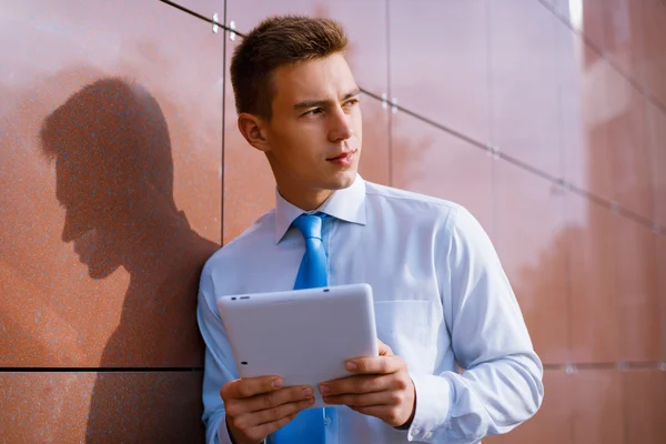 Smiling Businessman Holding Tablet Computer — Zdjęcie stockowe