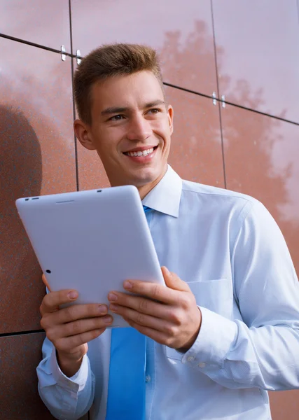 Smiling Businessman Holding Tablet Computer — Stok fotoğraf