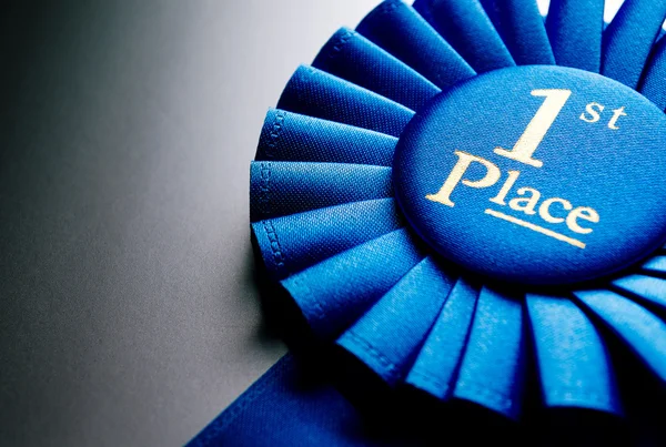 Blue first place winner rosette — Stock Photo, Image