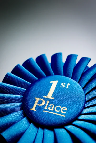 Blue first place winner rosette — Stock Photo, Image