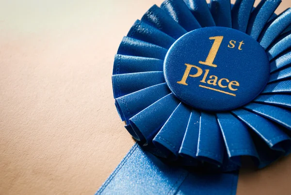 Blue first place winner rosette — Stock Photo, Image