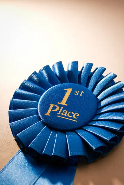 Blue first place winner rosette — Stock Photo, Image