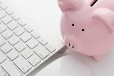 Piggy Bank and Keyboard on Top of White Table clipart