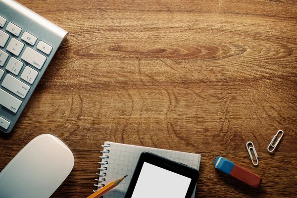 Devices and School Supplies on Wooden Table