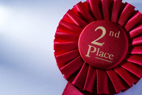 2nd place winners rosette in red ribbon — Stock Photo, Image