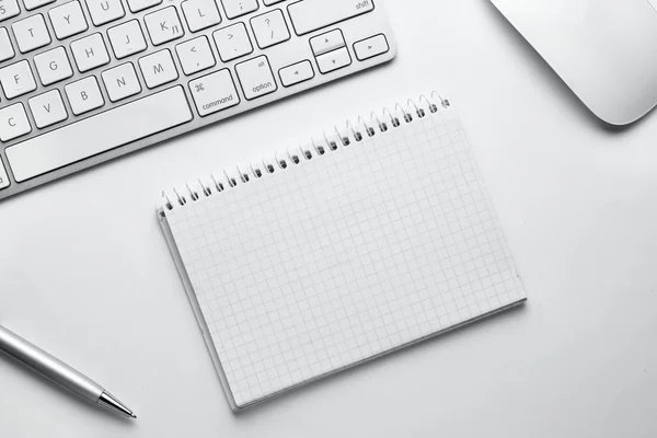 Pen, Notes, Keyboard and Mouse on White Table