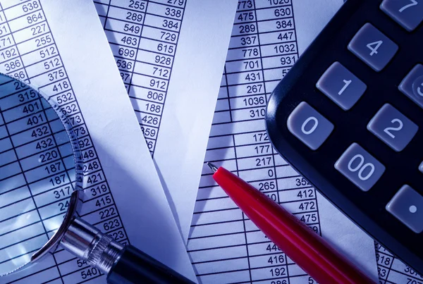 Calculator and Pen on Top of Paper Reports — Stock Photo, Image