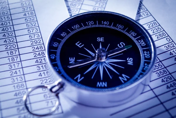 Compass Instrument on Top of Paper Reports — Stock Photo, Image