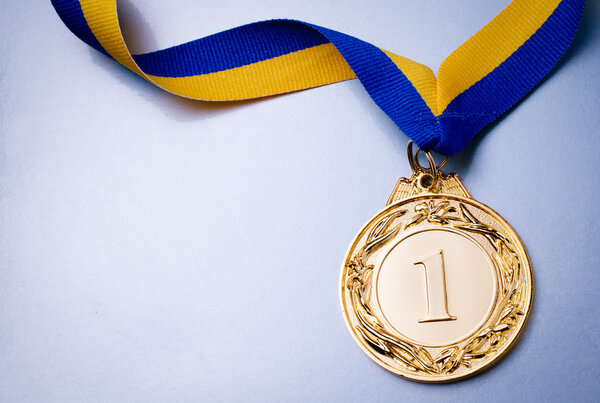 Gold medal on blue