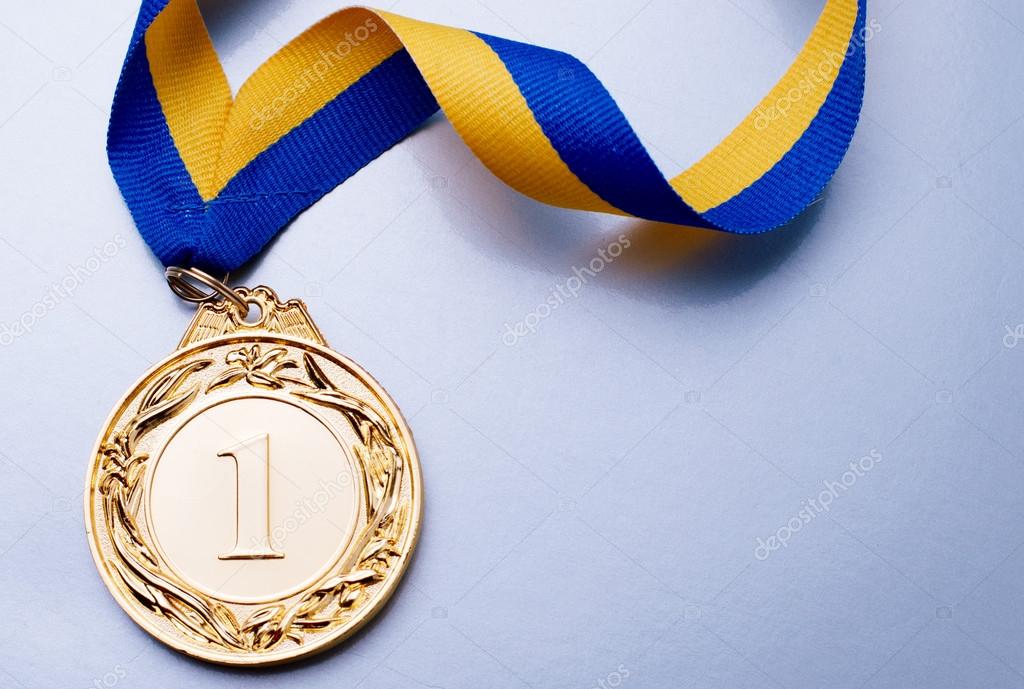 Gold medal on blue