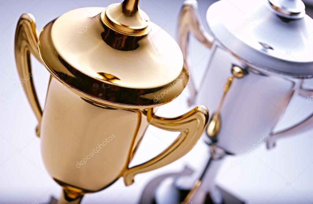Gold and silver trophies waiting to be awarded