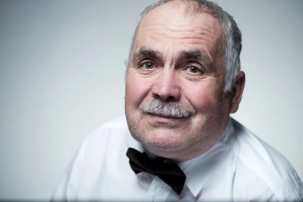 Close-up portrait of a Caucasian senior man with mustache — Stock Photo, Image