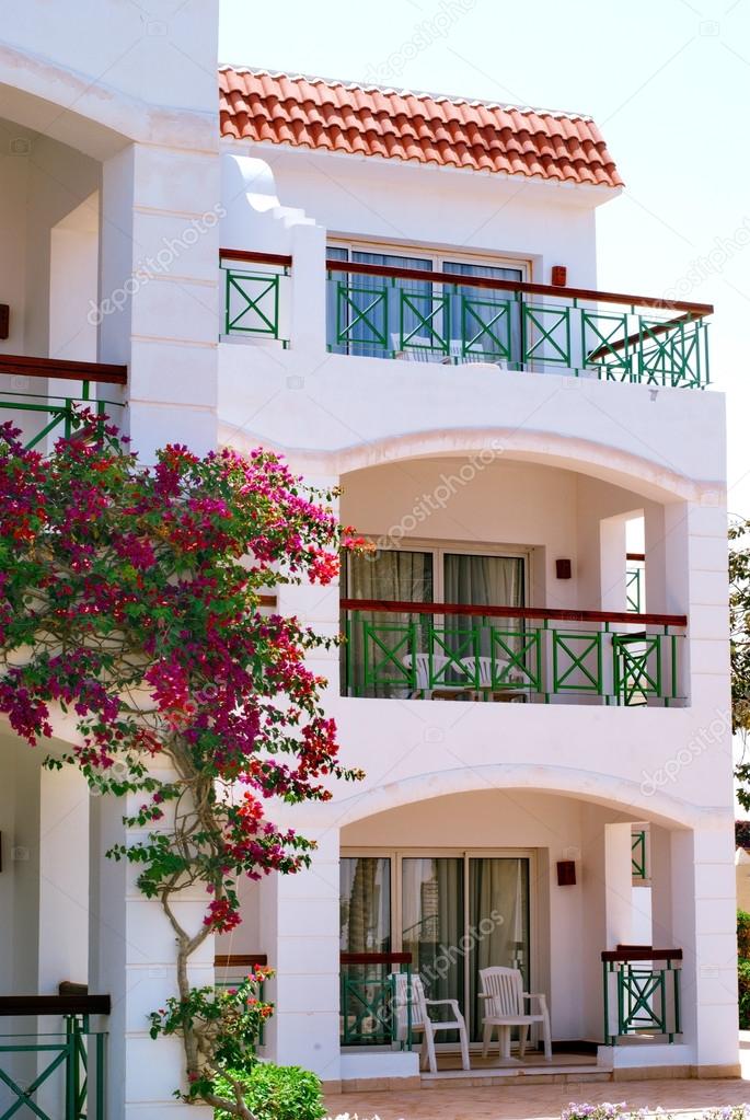 Facade of Hotel with balconies and windows decorated with flowers , Egypt
