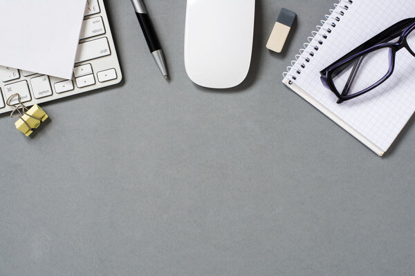 Keyboard, Mouse and Office Supplies on Grey Desk