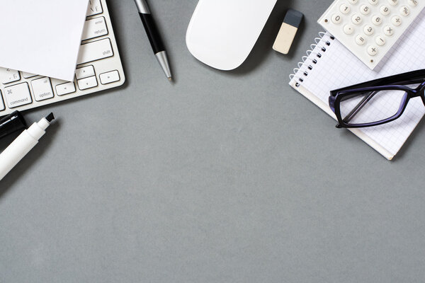 Keyboard, Mouse and Office Supplies on Grey Desk