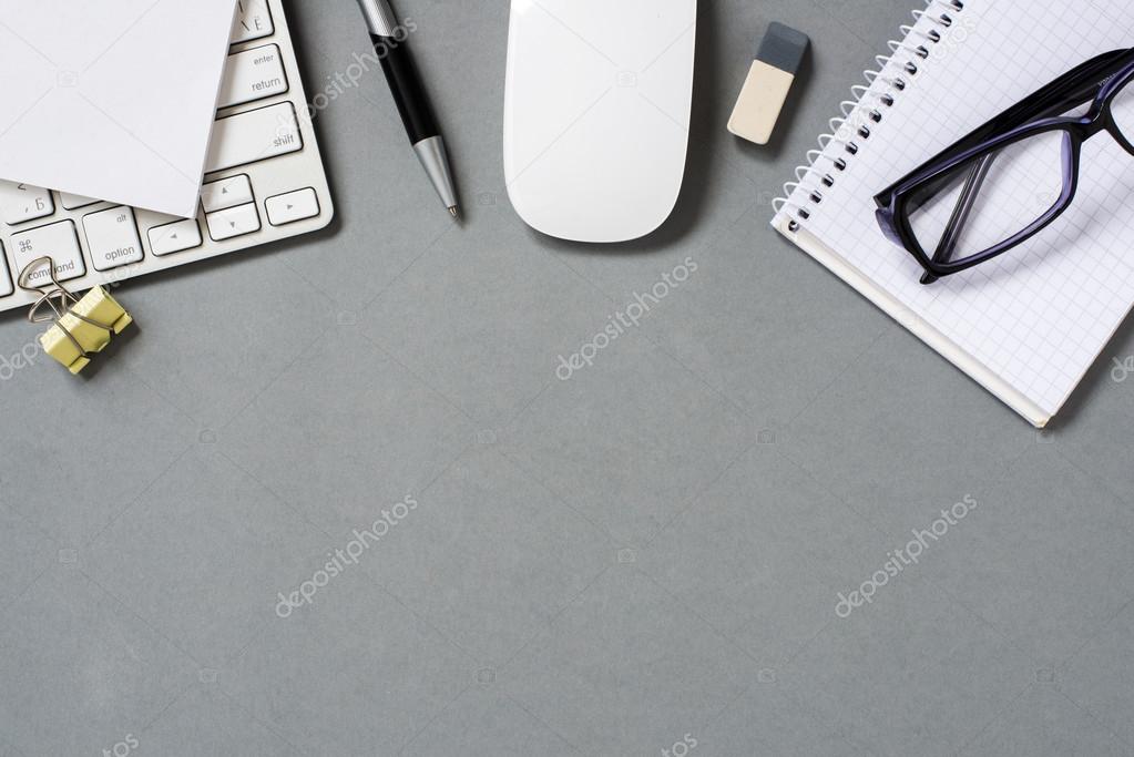 Keyboard, Mouse and Office Supplies on Grey Desk
