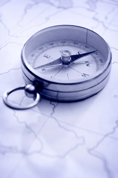 Close Up of Needle Compass on Line Map — стокове фото