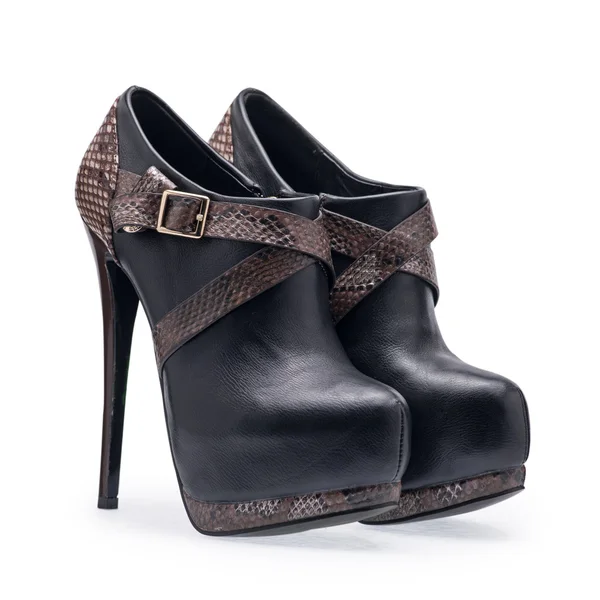A pair of women's shoes black stilettos with a decorative belt — Stock Photo, Image