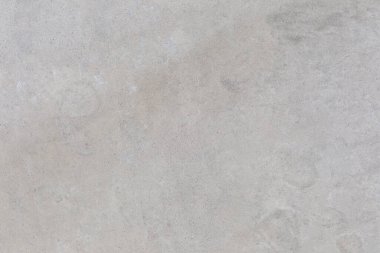 Açık gri, ince tahıl, pürüzsüz beton yüzey.