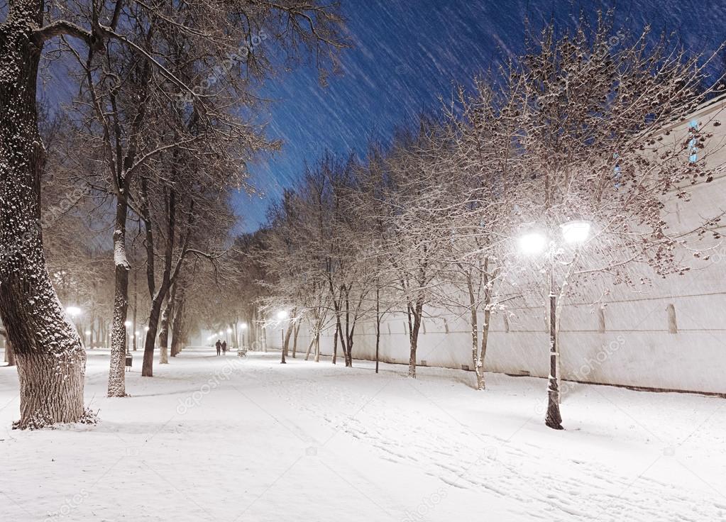 Snowy alley at night