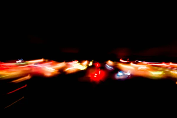 Abstracte Beweging Gedefocuste Lichten Donkere Achtergrond — Stockfoto