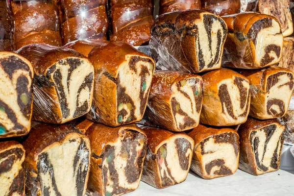 cakes with walnuts and cocoa wrapped in plastic wrap