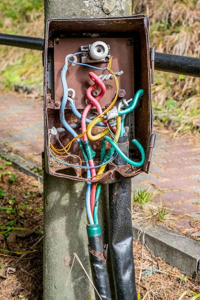 Electric Power Box With Cables and Wires on the pole with amateur connections