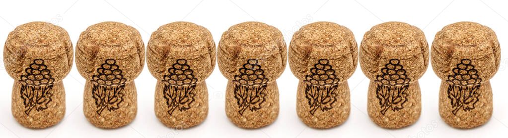 cork plugs from champagne bottles on white background