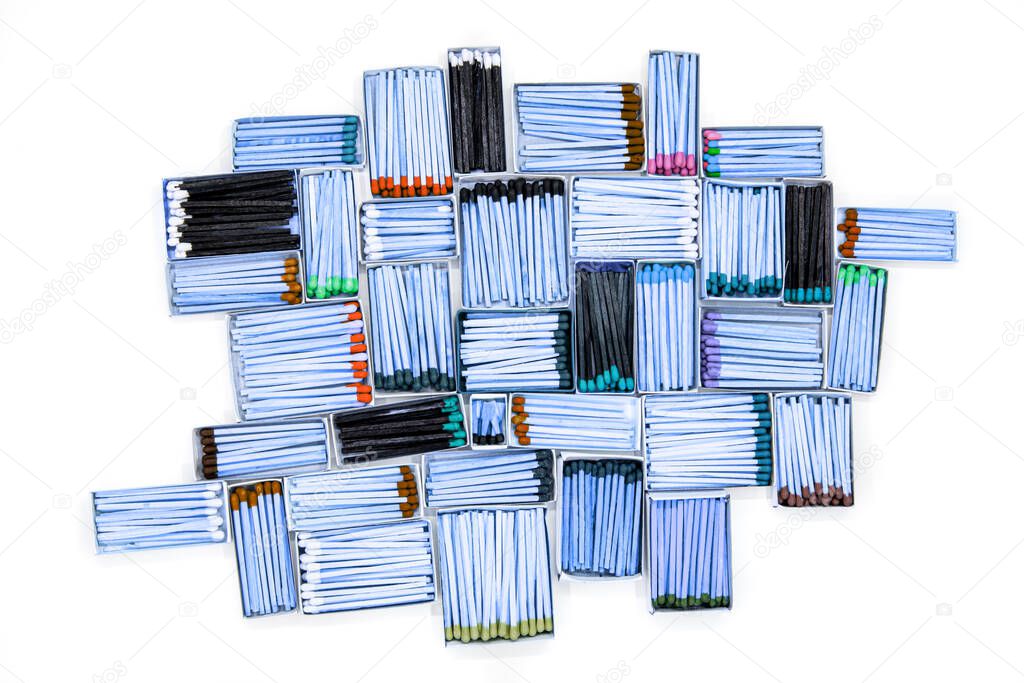 multicolored match sticks in boxes on a white background