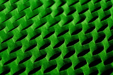 Altıgen hücresel bir yapı, tekrarlayan, dalgalı, oval şekilli kalıplara sahip bir ızgara.