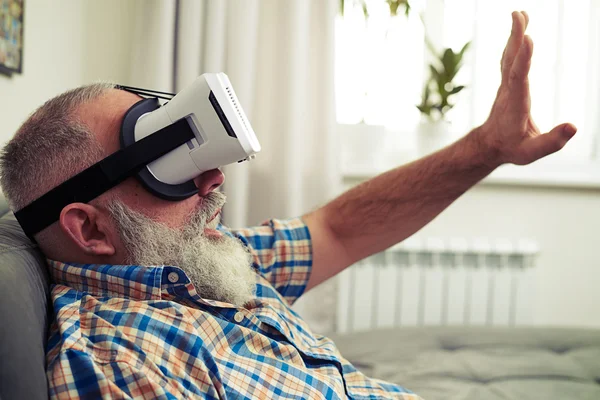 Man very excited using modern virtual reality headset glasses — Stock Photo, Image