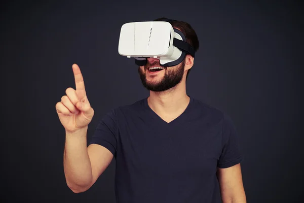 Man touch something using virtual reality glasses — Stock Photo, Image