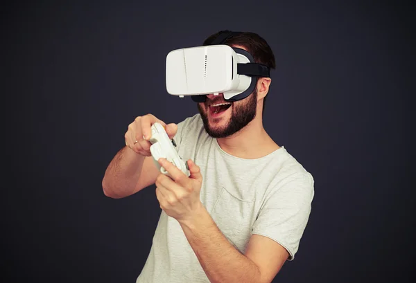 Man is playing on a joystick in virtual reality — Stock Photo, Image