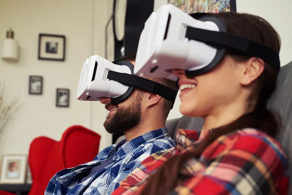 Close up of couple in virtual reality glasses — Stock Photo, Image