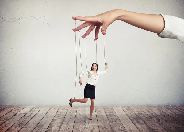 Woman looks like a puppet on strings — Stock Photo, Image
