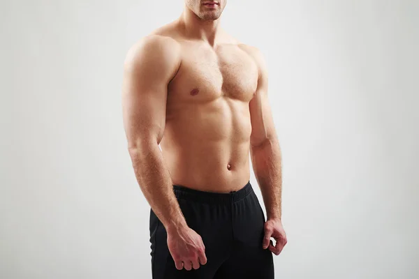 Muscular bare torso of athletic guy — Stock Photo, Image