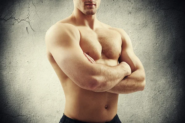 Close-up of bare-chested guy with arms crossed — Stock Photo, Image