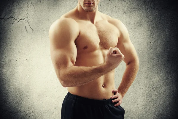 Close-up of bare-chested man showing his well trained body — Stock Photo, Image