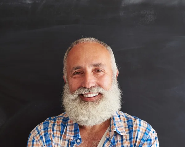 Close-up portrait of joyful and laughing softly bearded man