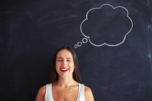 Delighted smiling woman closed her eyes while thinking about pla — Stock Photo, Image